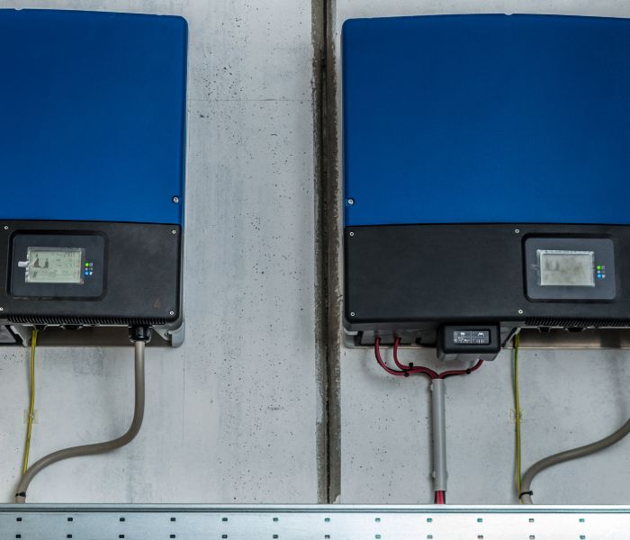 Connecticut solar energy inverter boxes on a structure.